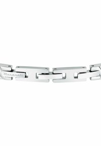 Silver metal chain bracelet with rectangular links, featuring polished finish and engraved-brand detail. Smooth texture, sturdy design.