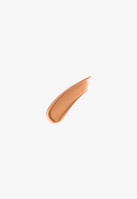 Liquid foundation in warm beige tone, smooth texture with a slight sheen, applied in a curved swipe on a white background.
