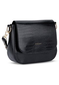 Black faux leather crossbody bag with croc embossing, gold hardware, flap closure, and adjustable strap. Features brand name in gold lettering.