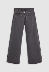 Jeans o szerokich nogawkach w ciemnoszarym dżinsie, z wysokim stanem, zapięciem na guzik z przodu oraz sznurkiem. Wyraźne pomarańczowe przeszycia jako akcenty.