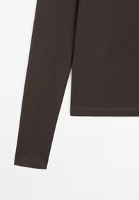 Brown long-sleeve shirt made of soft cotton blend, featuring a round neckline and a straight hem with neat stitching details.