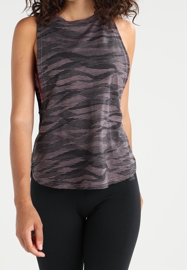 Débardeur sans manches noir et rose avec un motif rayé horizontal stratifié et un ourlet incurvé. Tissu léger avec une coupe décontractée.