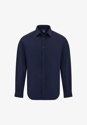 Chemise bleu marine à boutons, à manches longues, avec col pointu et ourlet courbé. Fabriquée en tissu lisse, elle présente des boutons noirs sur le devant.