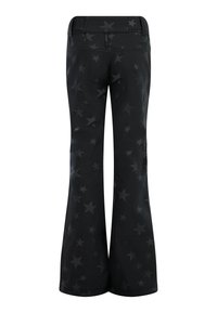 Pantalon noir évasé avec un motif étoilé subtil sur toute la surface, vu de dos, doté de passants pour ceinture et d’une taille ajustée.