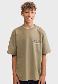 Olive green cotton t-shirt, loose fit, short sleeves, round neckline, featuring printed text design in navy and white accents.
