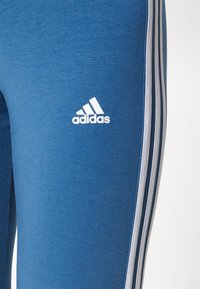 adidas Sportswear 3 STRIPES - Leggings - altered blue/white