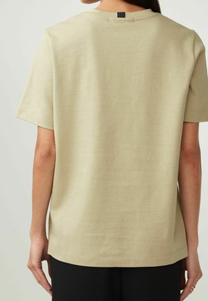 Kurzärmliges, hellbeiges T-Shirt aus glattem Stoff. Verfügt über einen runden Halsausschnitt und einen lässigen Schnitt mit geradem Saum. Rückansicht gezeigt.