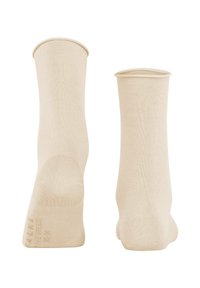 Beige Baumwollsocken mit geripptem Design, verstärkter Ferse und Zeh. Glatte Oberfläche und knöchellange Ausführung.