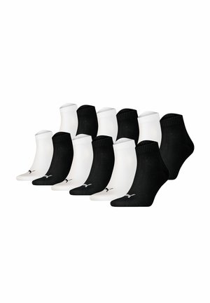 Pack of 12 ankle socks: 6 black and 6 white. Each sock features a ribbed cuff and a small logo on the side. Made of soft cotton blend.