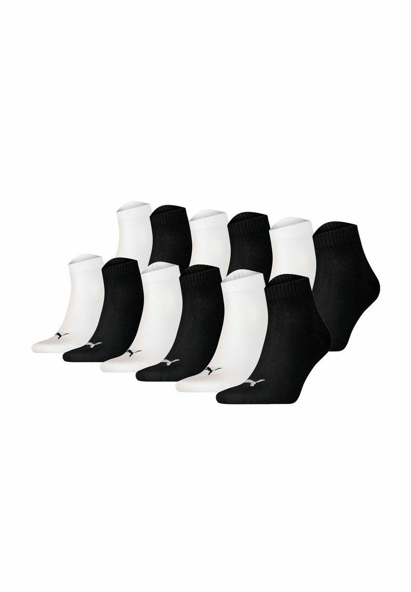 Pack of 12 ankle socks: 6 black and 6 white. Each sock features a ribbed cuff and a small logo on the side. Made of soft cotton blend.