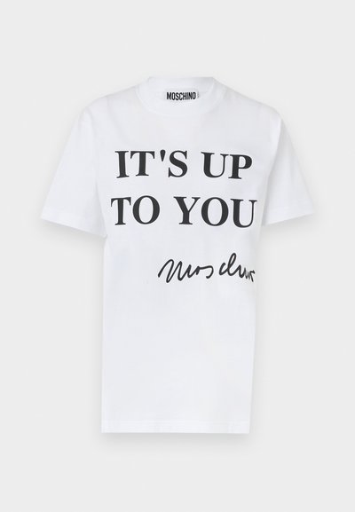 Vit bomull T-shirt med fet svart text: "DET ÄR UPP TILL DIG" och signaturstil längst ner. Klassisk rundhalsdesign.