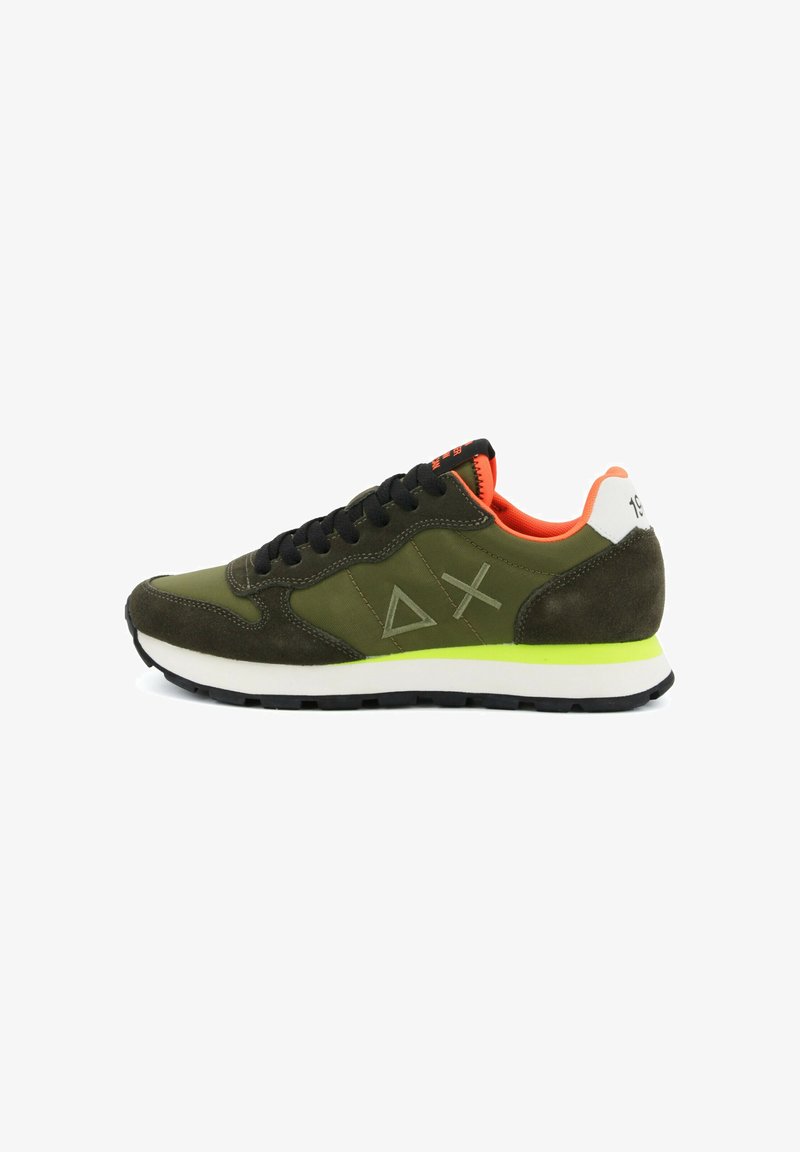 Olive green sneaker with black laces, neon yellow midsole stripe, orange inner lining, and geometric symbols on the side.