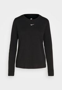 Svart långärmad skjorta i bomull med rund halsringning. Har en liten vit Nike-logotype på vänster bröstområde, med enkla manschetter.