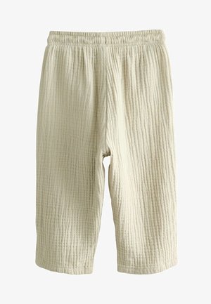 Svetlo bež, teksturirane kratke hlače z ribasto strukturo in elastičnim pasom. Narejene iz zračnega materiala, primerne za sproščeno nošenje.