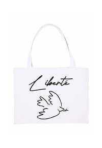 Borsa tote in canvas bianca con una linea nera che rappresenta una colomba e la parola "Liberté" in un font artistico. Design piatto, senza ulteriori decorazioni.
