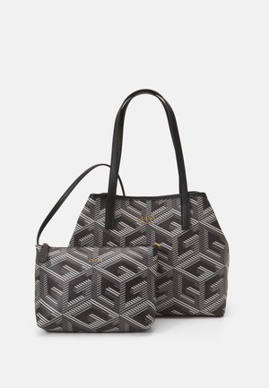 Sac à main Guess noir et gris à motifs et petite pochette assortie avec logo doré et poignées noires, présenté sur fond blanc.