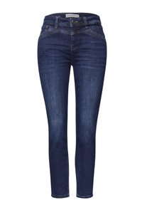 Tmavě modré úzké džíny s hladkou texturou, vybavené předními kapsami a dekorativním prošitím na bocích. Zapínání na kovový knoflík.