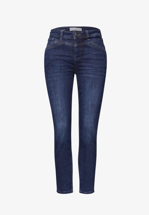 Ciemnoniebieskie obcisłe dżinsy o gładkiej fakturze, z przednimi kieszeniami i dekoracyjnym przeszyciem na biodrach. Zapięcie na metalowy guzik.