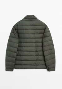 Olive green puffer jacket with a textured, quilted surface, featuring a collar and long sleeves. Simple, functional design without embellishments.