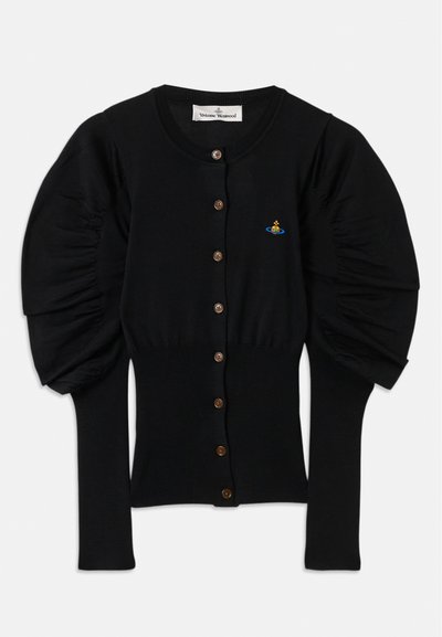 Juodas megztas kardiganas su pūstomis rankovėmis, aštuoni rudai sagos priekyje ir mažas spalvingas siuvinėjimas šalia krūtinės.