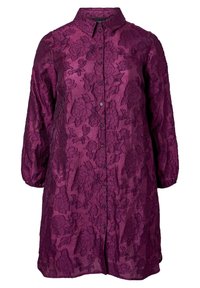 Violetti paita, jossa on kukkakuosi, valmistettu teksturoidusta kankaasta. Omistaa pitkät hihat, napitettu etuosa ja kauluksen.