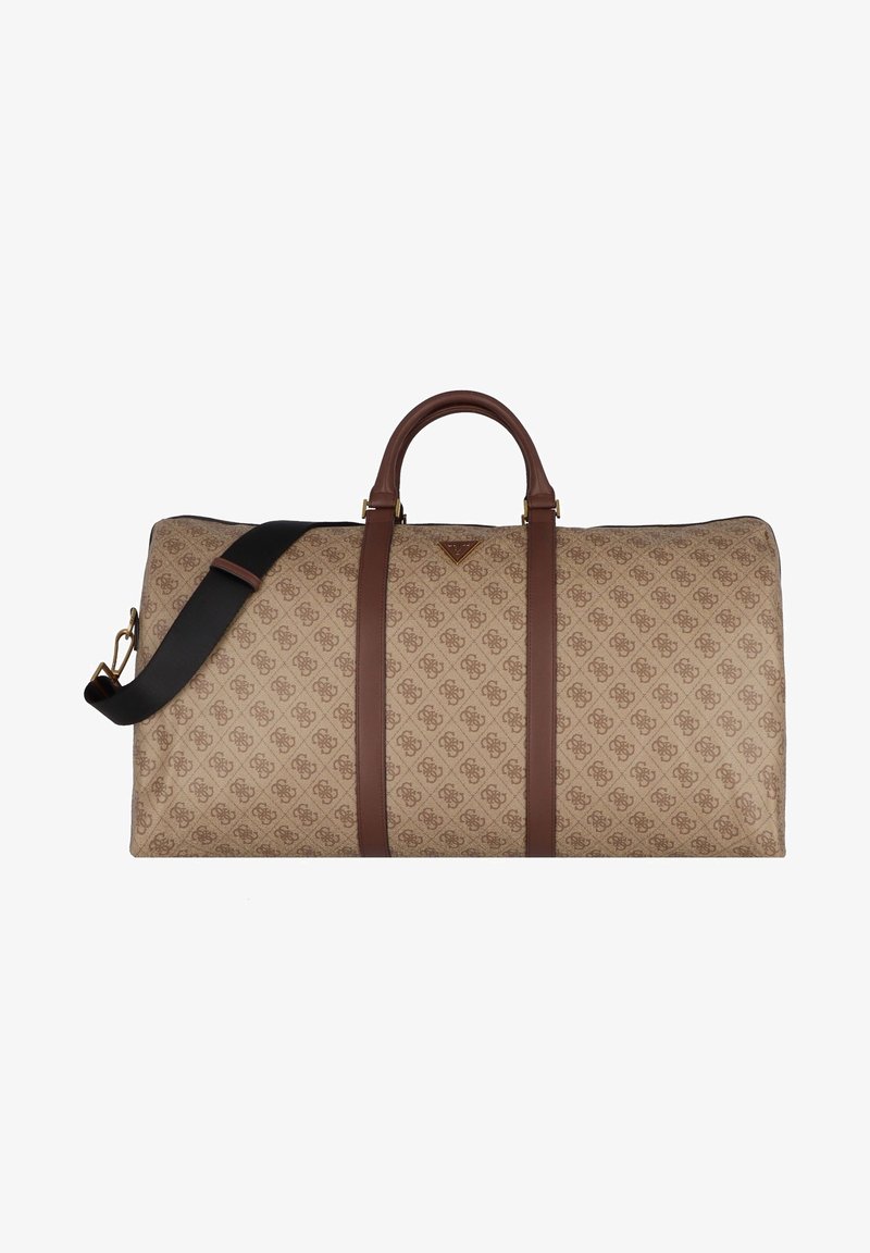 Grand sac de voyage rectangulaire beige avec poignées en cuir marron, deux sangles verticales en cuir et une bandoulière noire réglable.