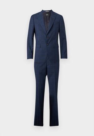 Tengerészkék férfi öltöny finom ablakrácsos mintázattal, kétgombos zakóval, behúzott gallérokkal és hozzáillő szabott nadrággal.