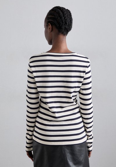 Long-sleeve top in ribbed fabric with navy and white horizontal stripes. Features a wide neckline and slightly fitted shape.