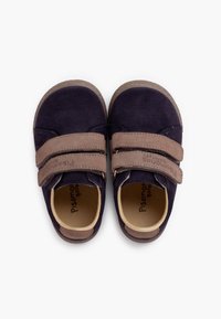 Navy suede shoes with brown Velcro straps, round toe, and soft lining. Features a textured rubber sole and brand name inside.