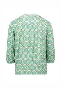 Green patterned blouse featuring a geometric design, three-quarter sleeves, and a relaxed fit, made from lightweight fabric.