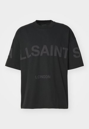 T-shirt en coton noir oversize avec des manches courtes. Présente un grand logo tonal "ALLSAINTS" et le texte "LONDON" sur le devant.