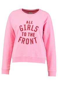 Felpa rosa con maniche raglan, caratterizzata da un audace design testuale rosso: "TUTTE LE RAGAZZE DAVANTI" in evidenza sulla parte frontale. Tessuto morbido.