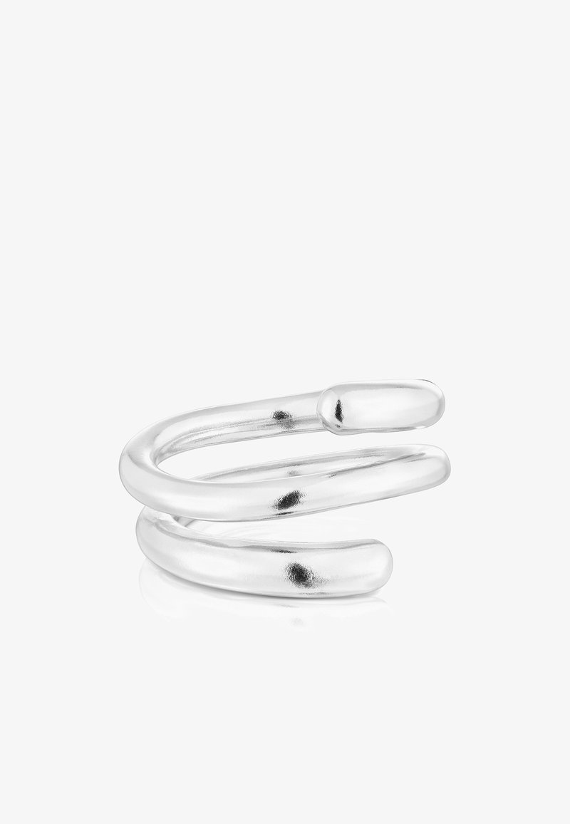 Anillo de metal en tono plateado con un diseño en espiral continuo. Superficie lisa y pulida con extremos redondeados y una estética minimalista. Sin acentos adicionales.