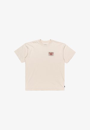 T-shirt in cotone beige con collo rotondo e maniche corte. Il fronte presenta un design grafico colorato con elementi decorativi.