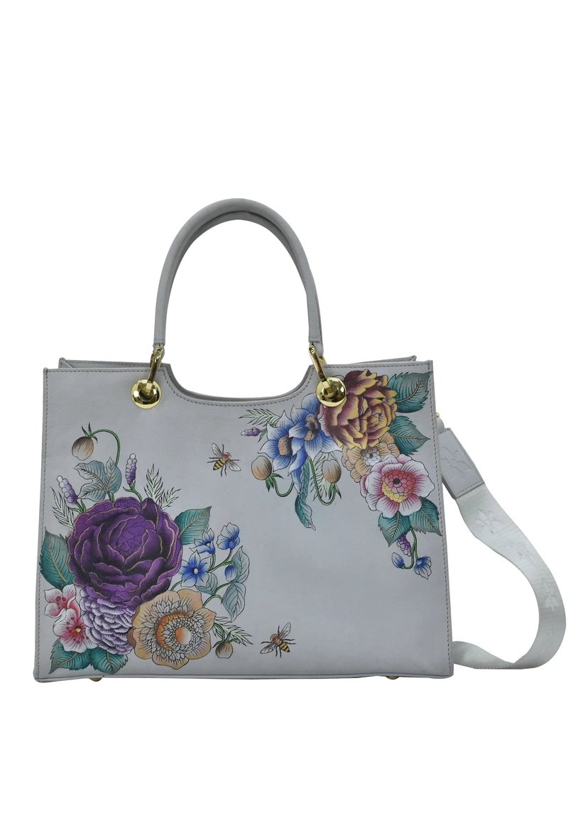 Grijze leren totebag met bloemontwerpen in paars, blauw en perzik. Gouden hardware accenten en een afneembare schouderband.