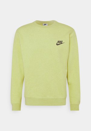 Gelbes Sweatshirt mit Rundhalsausschnitt, langen Ärmeln und kleinem schwarzem Nike-Logo auf der Brust. Weicher, strukturierter Stoff mit meliertem Finish.