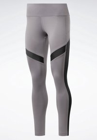 Leggings sportivi grigi con un design a vita alta, caratterizzati da pannelli neri e dettagli testurizzati lungo i lati. Finitura in tessuto liscia.
