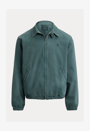 Žalia medvilninė striukė su smailiu apykakliu, priekyje su užtrauktuku ir šoninėmis kišenėmis. Yra elastinės rankogaliai ir mažas logotipas ant krūtinės.