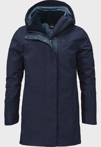 Marineblauer wasserdichter Mantel mit einem mit Fell gefütterten Kragen, kontrastierendem Innenfutter, seitlichen Reißverschlusstaschen und GORE-TEX-Branding am Ärmel.