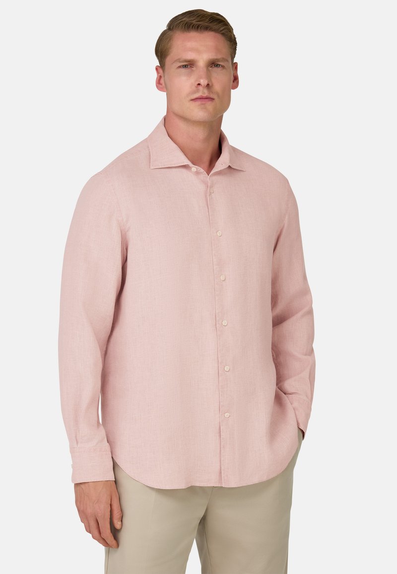 Camicia in lino rosa pallido con maniche lunghe, bottone frontale e colletto a punta. Tessuto liscio con un sottile motivo a trama. Orlo arrotondato.