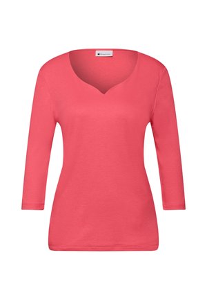 Korallenrotes Langarmoberteil aus glattem Stoff mit V-Ausschnitt und figurnahem Schnitt. Schlichtes Design ohne Muster oder zusätzliche Verzierungen.