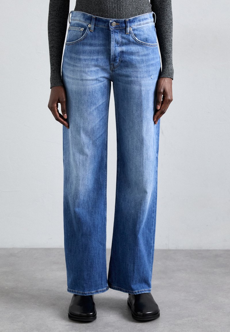 Wide-leg blue denim jeans with a faded wash, featuring five pockets and a button closure. Smooth texture and straight hemline.