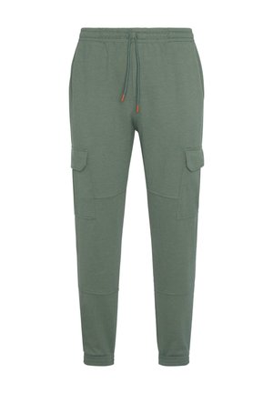 Green cotton joggers with an elastic waistband, adjustable drawstring, and two cargo pockets on the sides. Smooth texture, tapered fit.