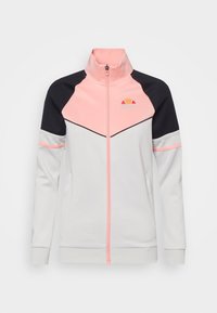 Zippered track jacket in grey and black with pink accents; features a high collar and side pockets; logo displayed on the chest.
