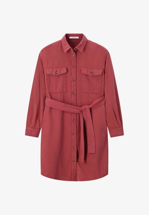 Red shirt dress with a button-up front, two chest pockets, and a belt at the waist. Long sleeves with buttoned cuffs. Cotton material.
