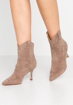 Biker-/cowboynilkkurit - taupe