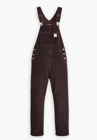 Bruna kordflorsbyxor med justerbara remmar, framficka, sidoknappar och tapered ben. Texturerat tyg med vertikala ribbor.