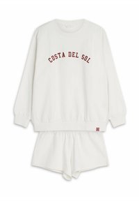 Biały zestaw odzieży domowej z bawełny, składający się z bluzy z długim rękawem z napisem "COSTA DEL SOL" w czerwonym kolorze oraz pasujących szortów z elastycznym pasem.