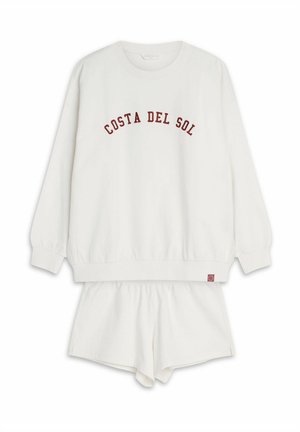 Biały zestaw odzieży domowej z bawełny, składający się z bluzy z długim rękawem z napisem "COSTA DEL SOL" w czerwonym kolorze oraz pasujących szortów z elastycznym pasem.