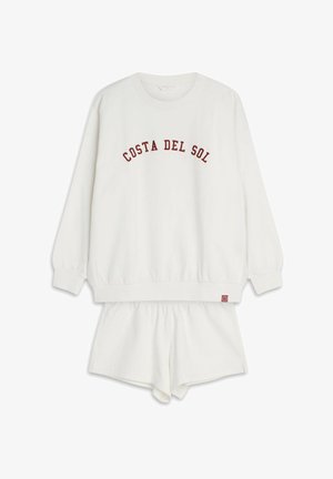 Biały zestaw odzieży domowej z bawełny, składający się z bluzy z długim rękawem z napisem "COSTA DEL SOL" w czerwonym kolorze oraz pasujących szortów z elastycznym pasem.